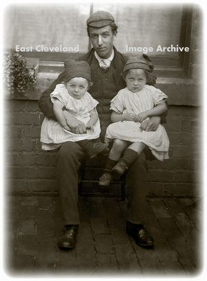 Man and two children 